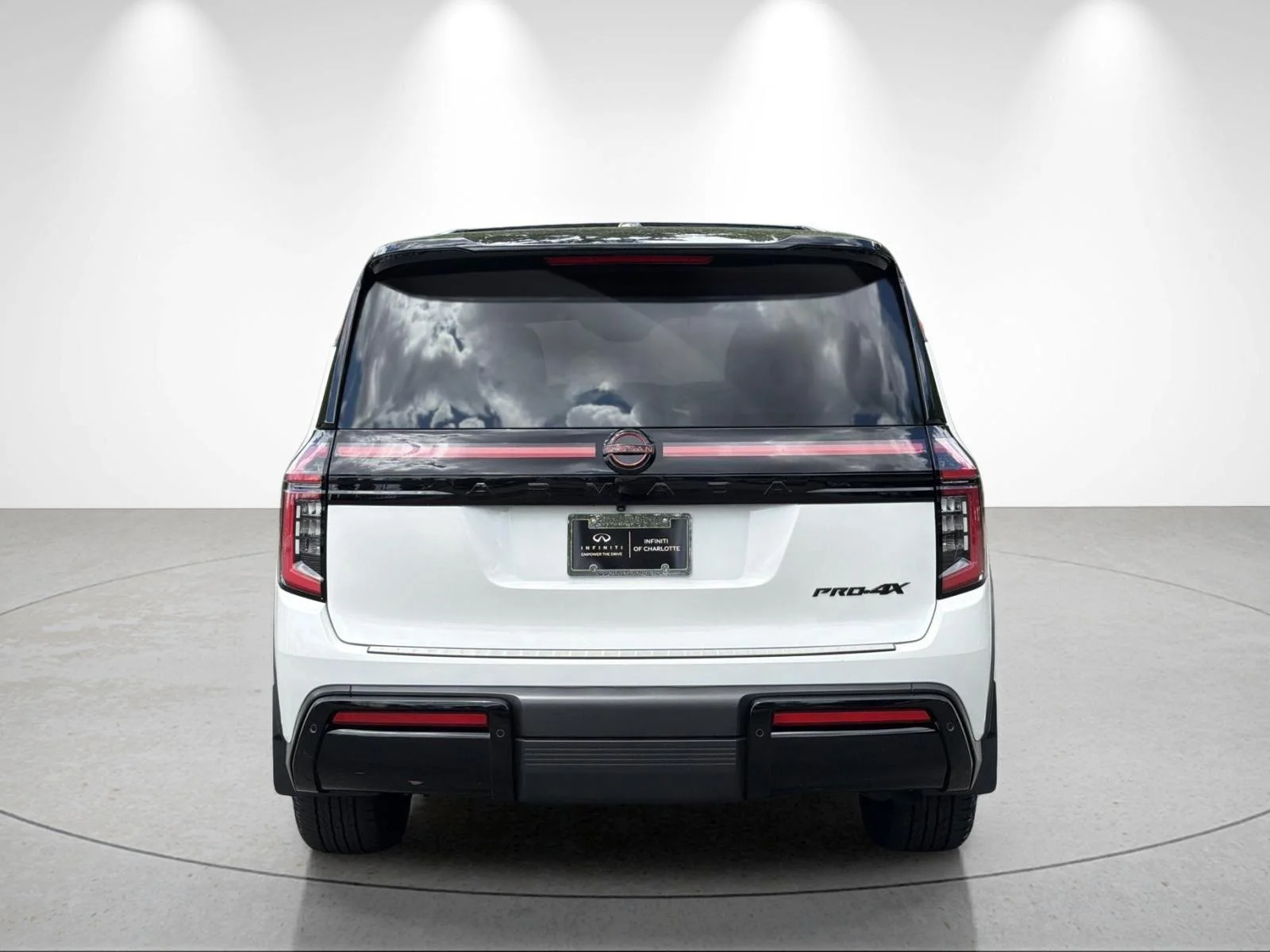 Used 2025 Aspen White Tricoat/Super Black Nissan PRO-4X image 4