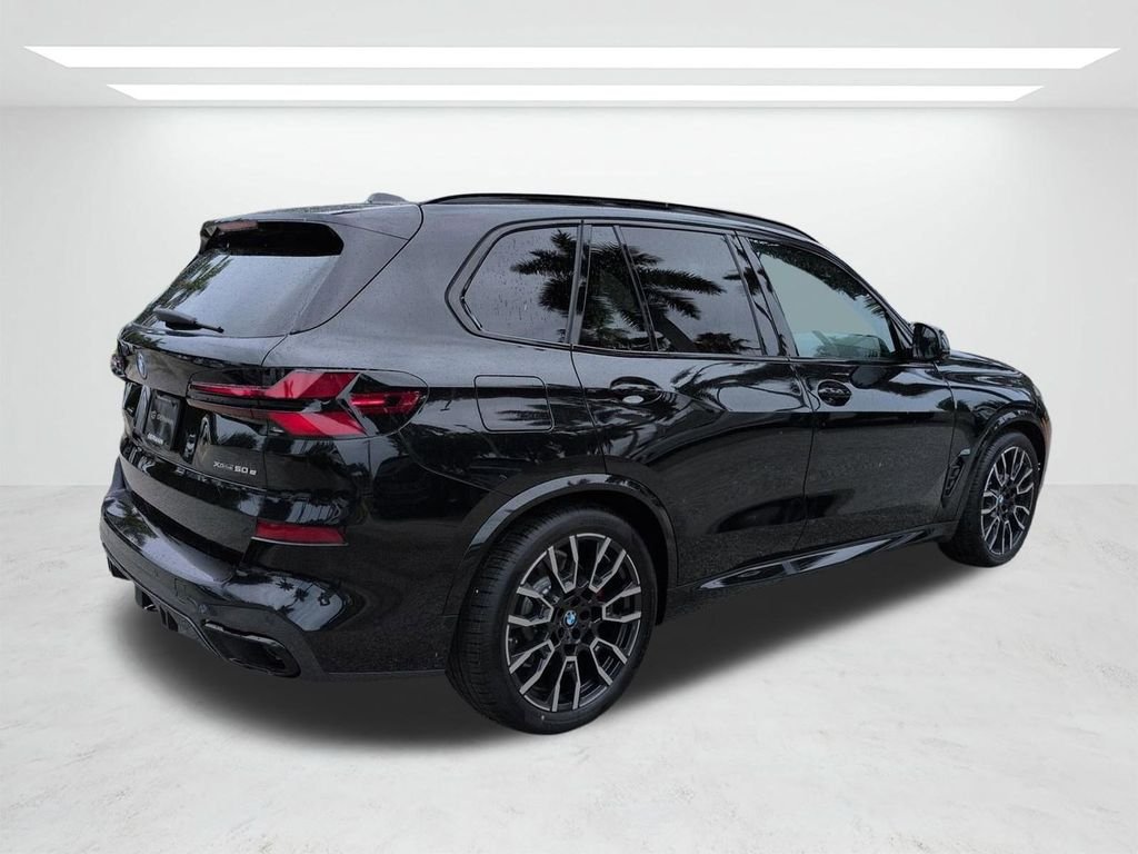 New 2026 Black Sapphire Metallic BMW xDrive50e image 4