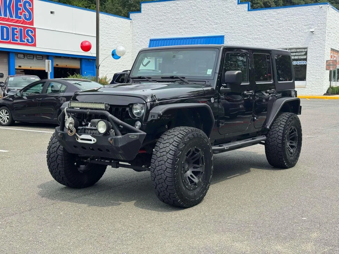 Used 2015 Black Clearcoat Jeep Sport image 4