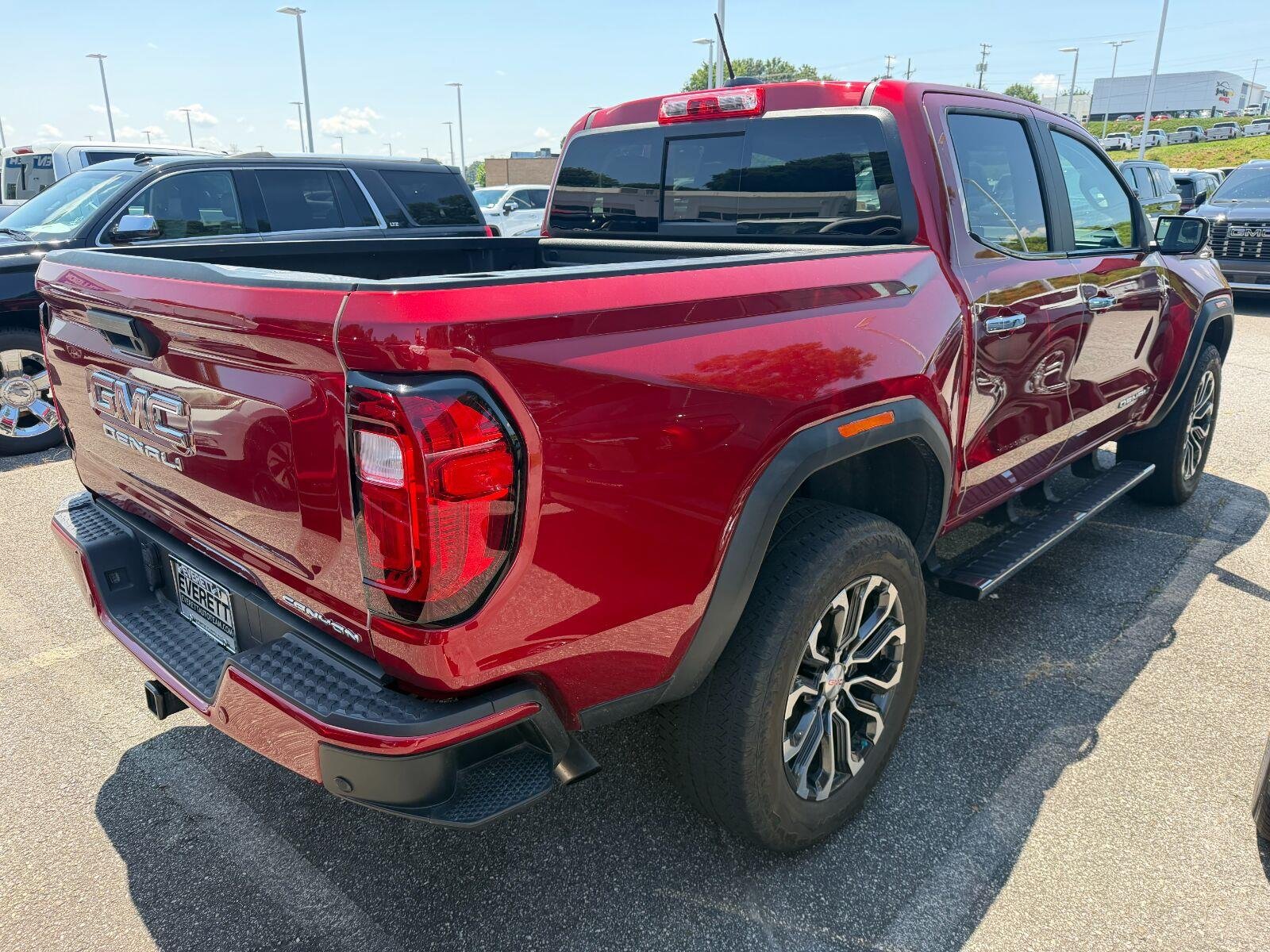 Used 2023 VOLCANIC RED TINTCOAT GMC 4WD Denali image 3