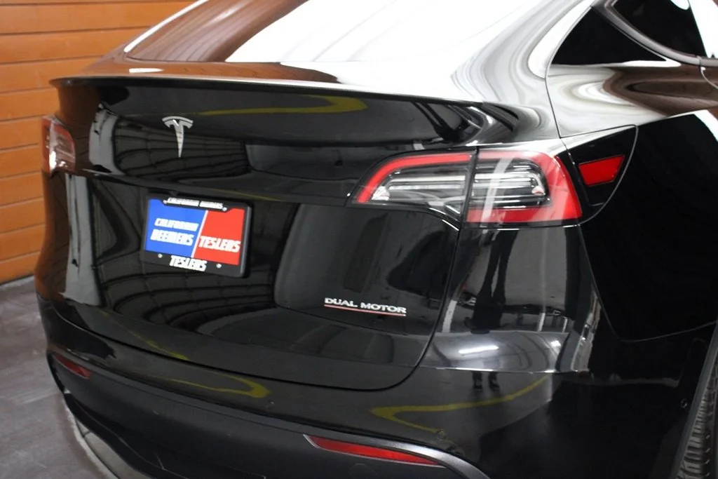 Used 2022 Solid Black Tesla Performance image 7