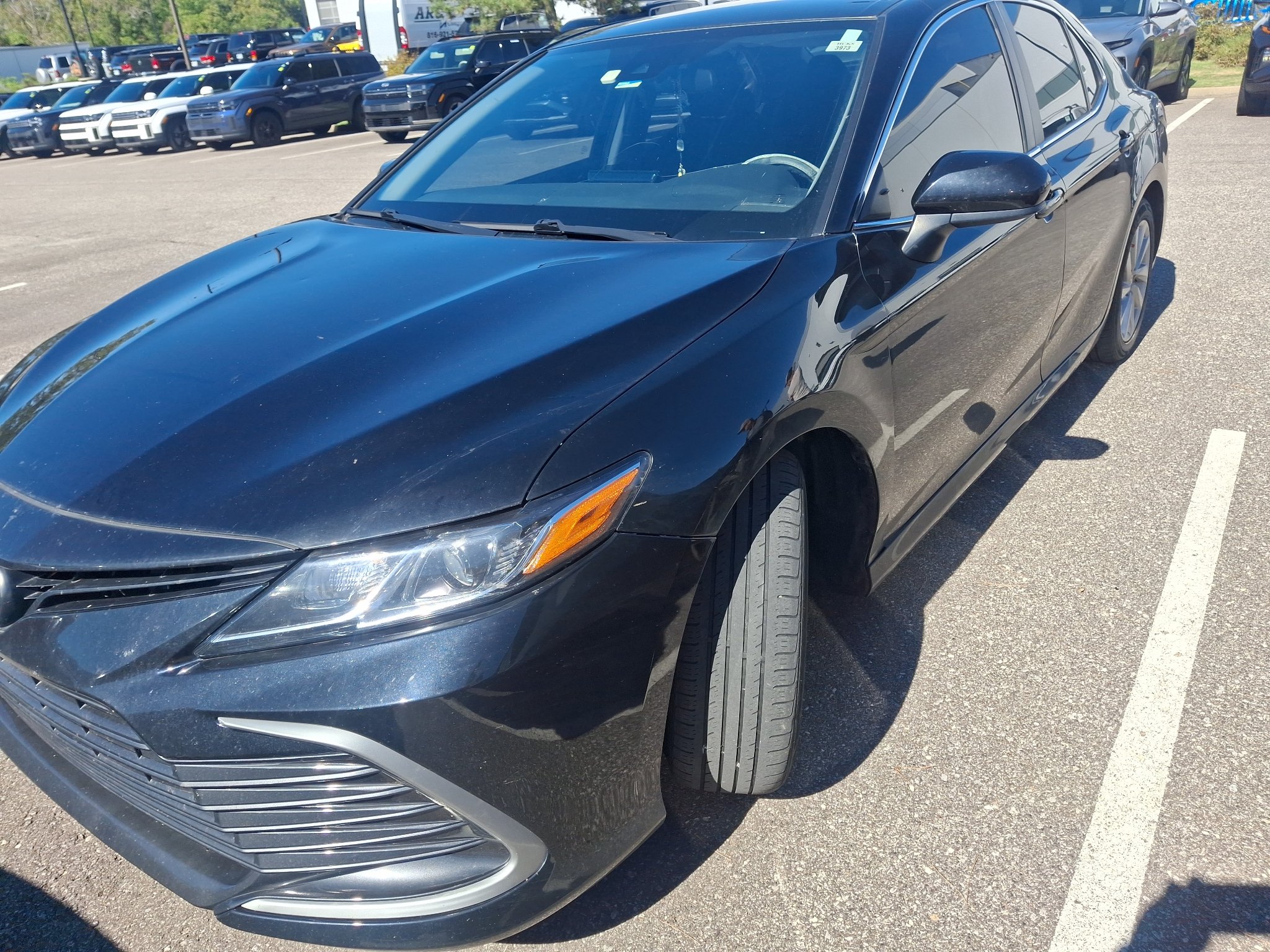 Used 2022 Midnight Black Metallic Toyota LE image 1