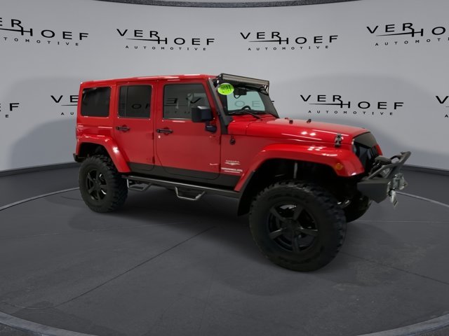 Used 2011 Jeep Wrangler Unlimited Sahara with VIN 1J4BA5H10BL593659 for sale in Sioux Center, IA