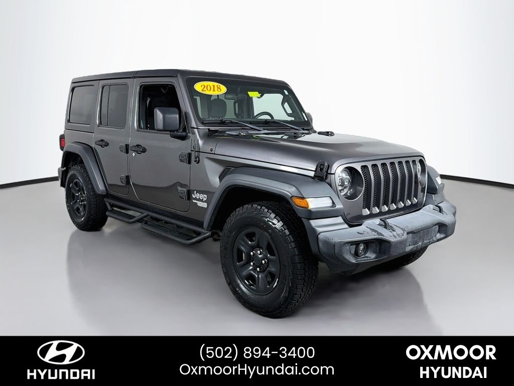 Used 2018 Granite Crystal Metallic Clearcoat Jeep Sport image 1