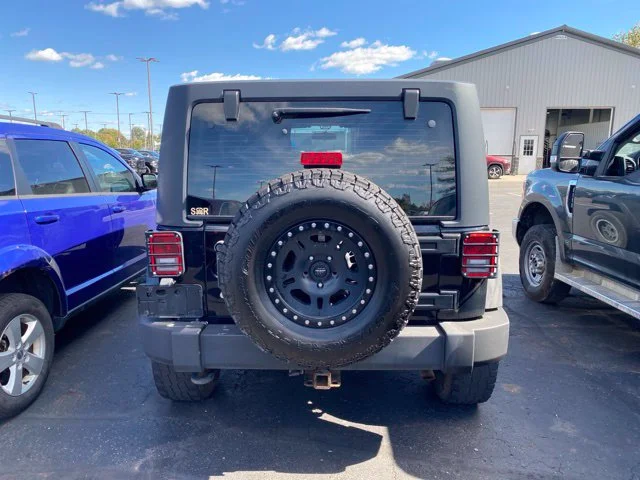 Used 2013 Black Jeep Unlimited Sport image 3