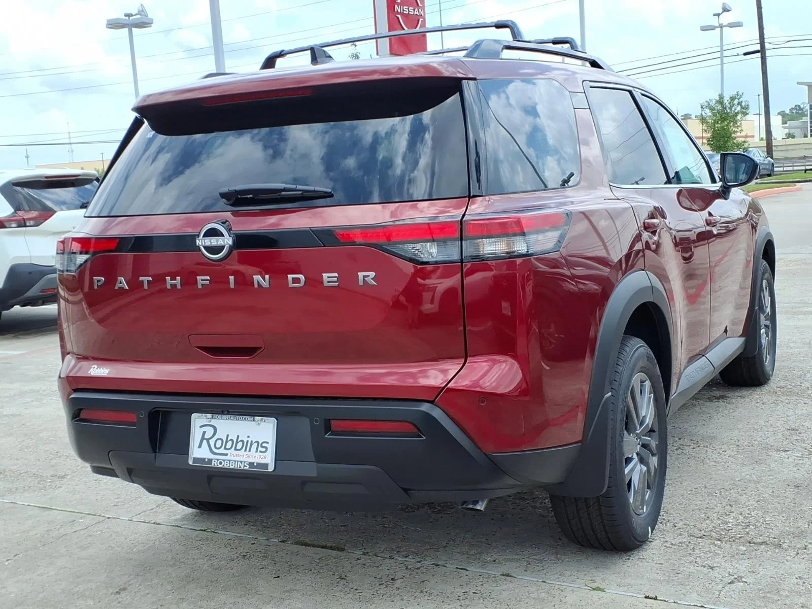 2026 Nissan Pathfinder SV Red at Robbins Nissan