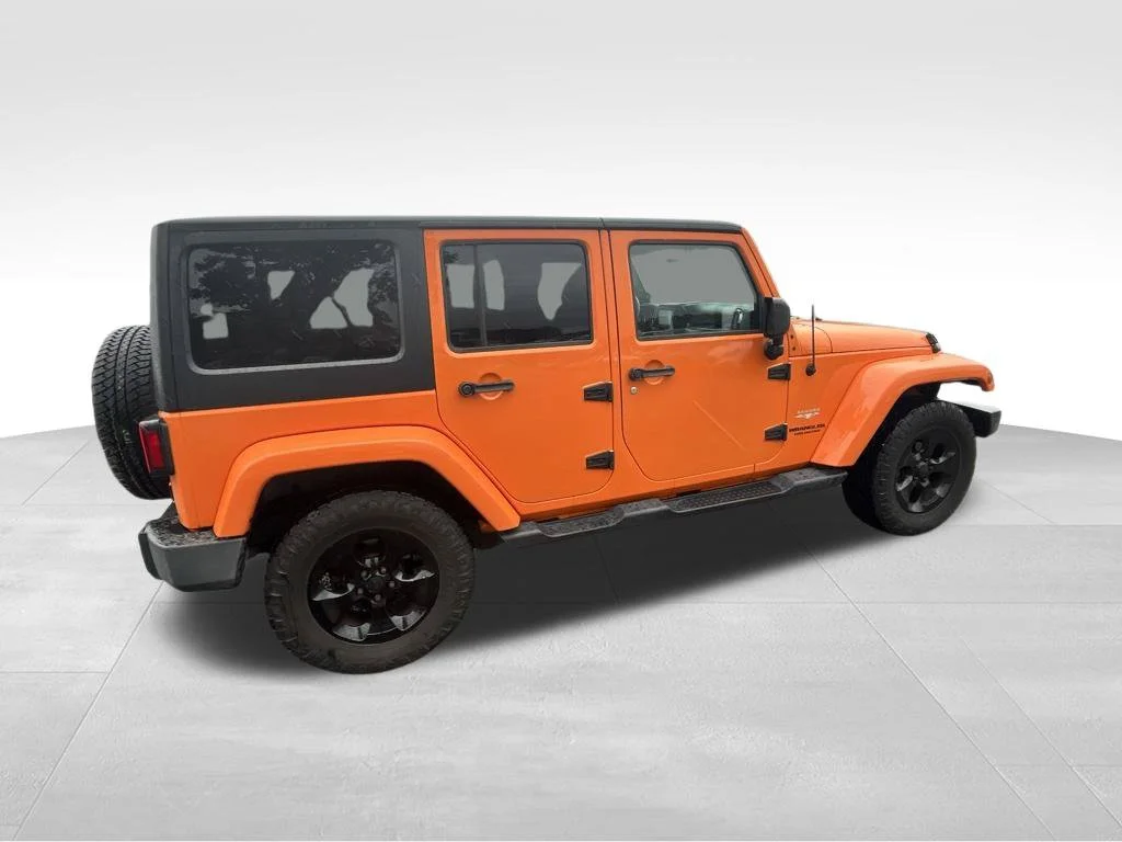 Used 2013 Orange Jeep Unlimited Sahara image 14