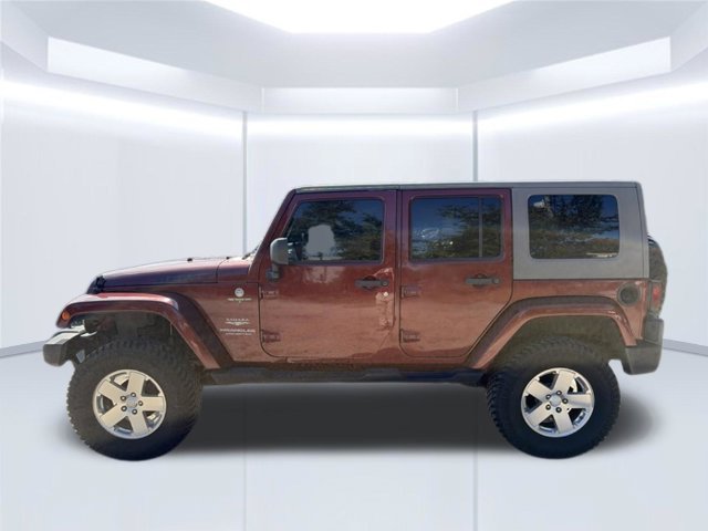 Used 2010 Red Jeep Unlimited Sahara image 10