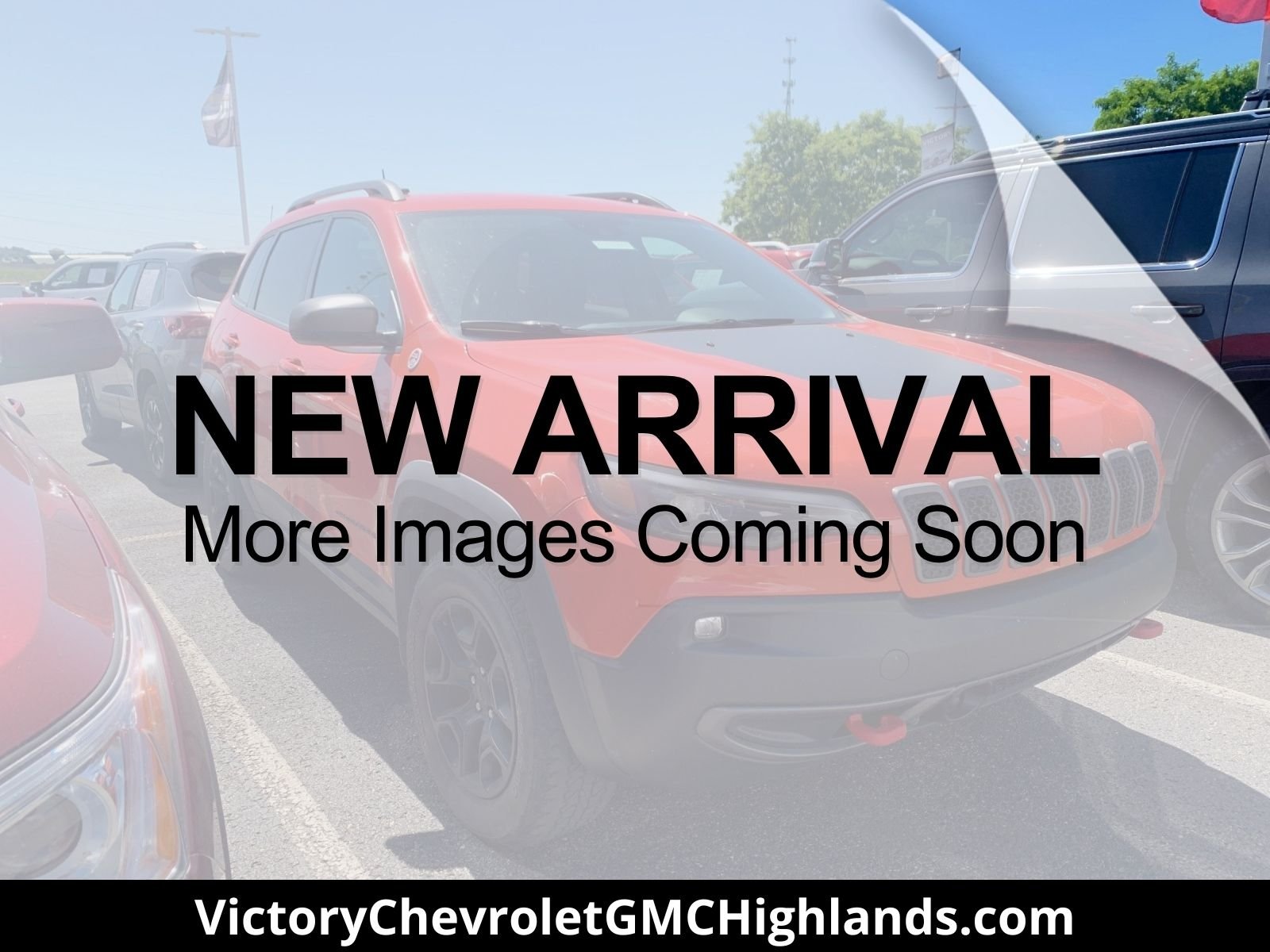Used 2021 Orange Jeep Trailhawk image 1