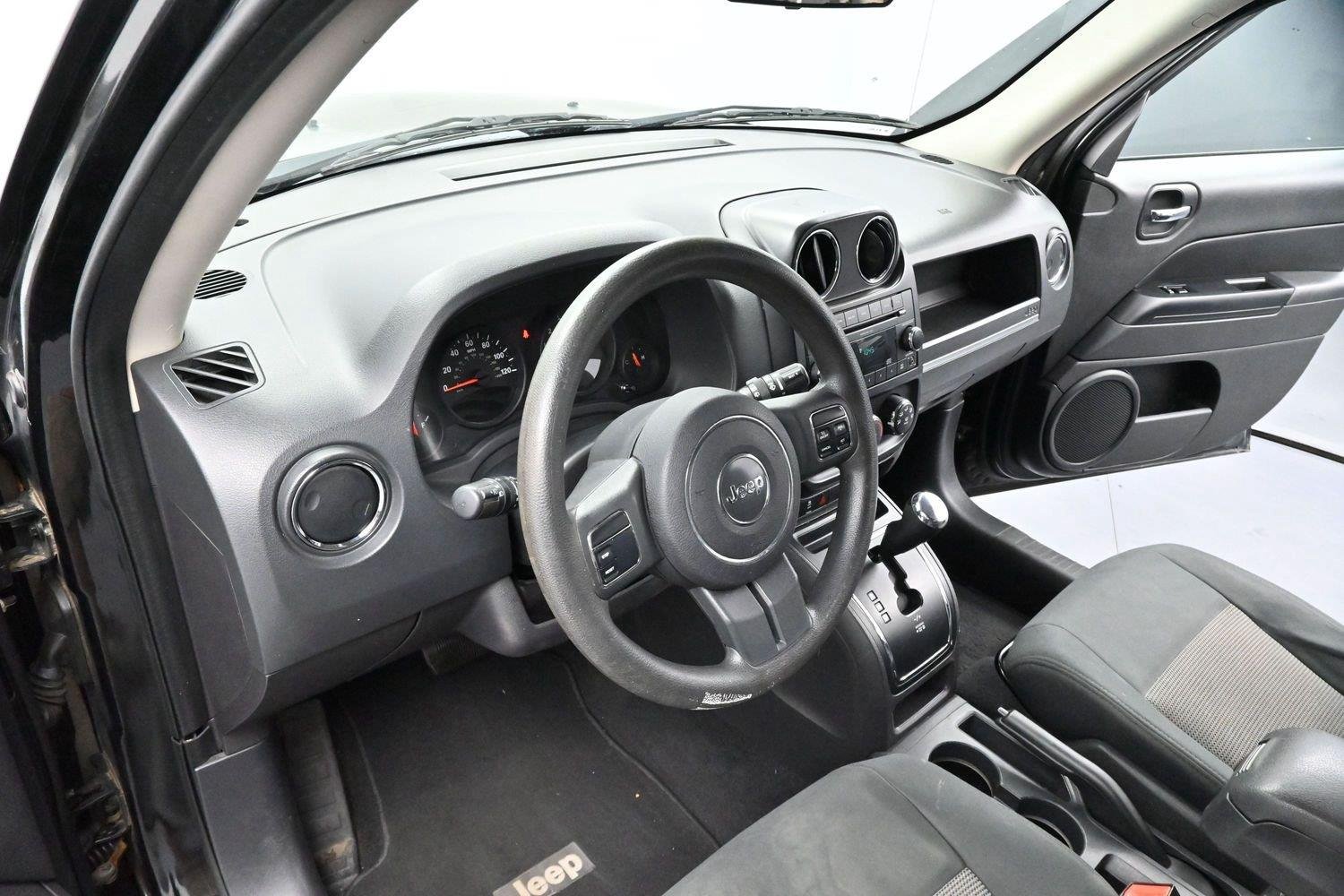 Used 2011 Brilliant Black Crystal Pearl Jeep Sport image 12