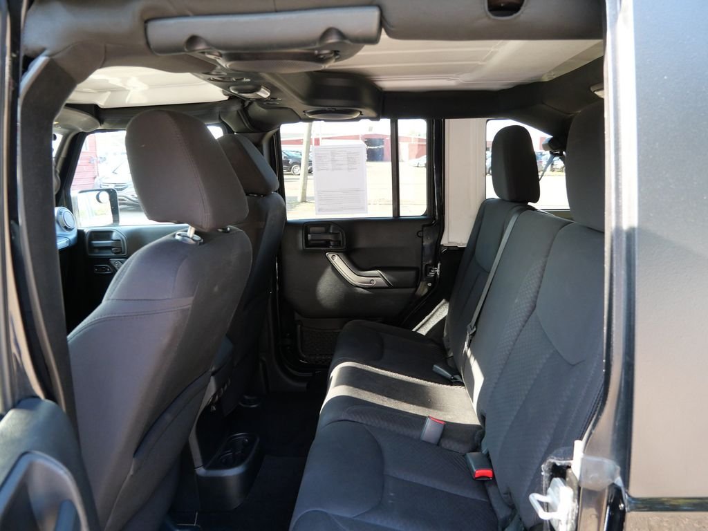 Used 2013 Black Jeep Unlimited Sport image 13