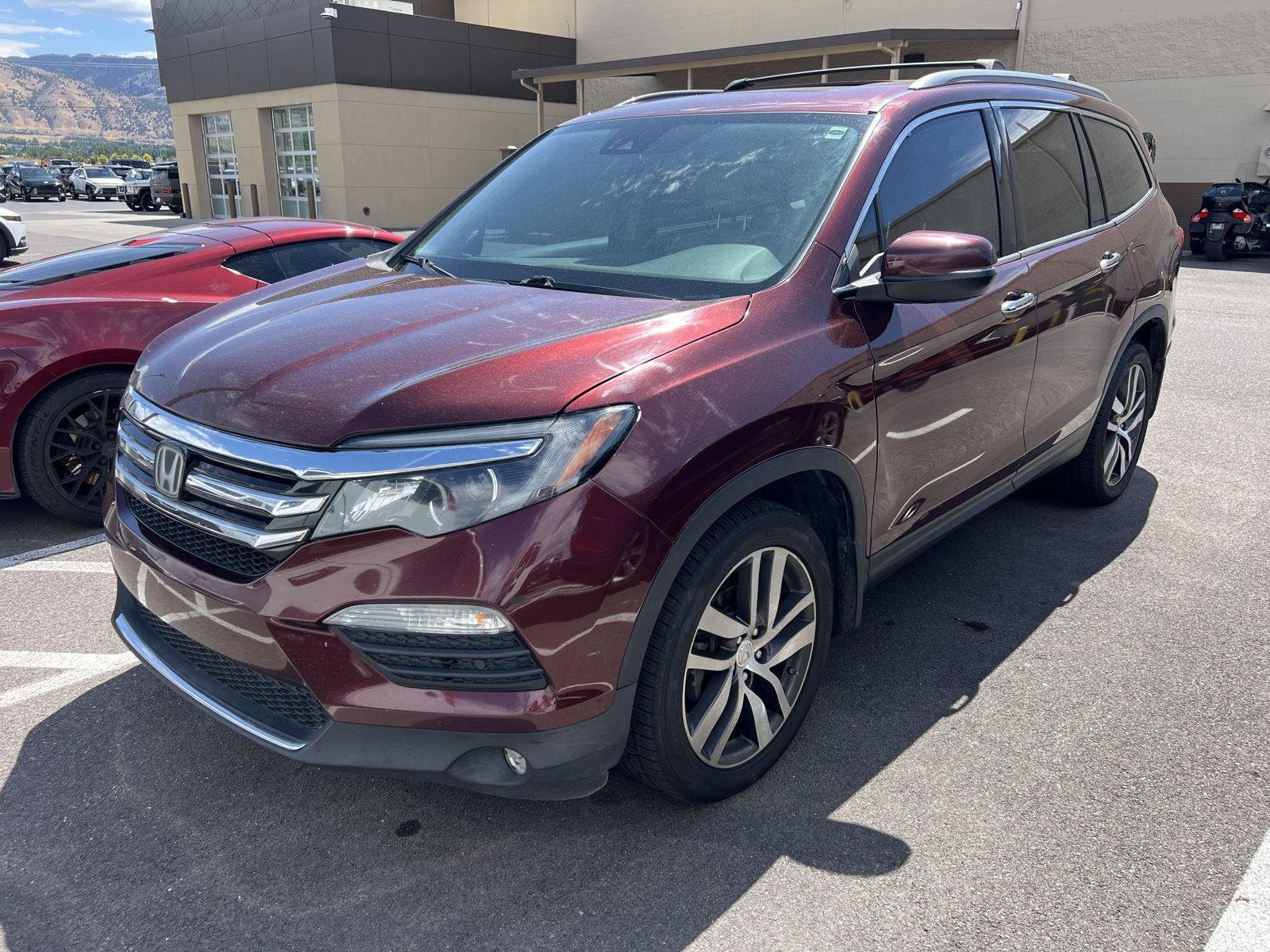 Used 2018 Deep Scarlet Pearl Honda Elite image 1