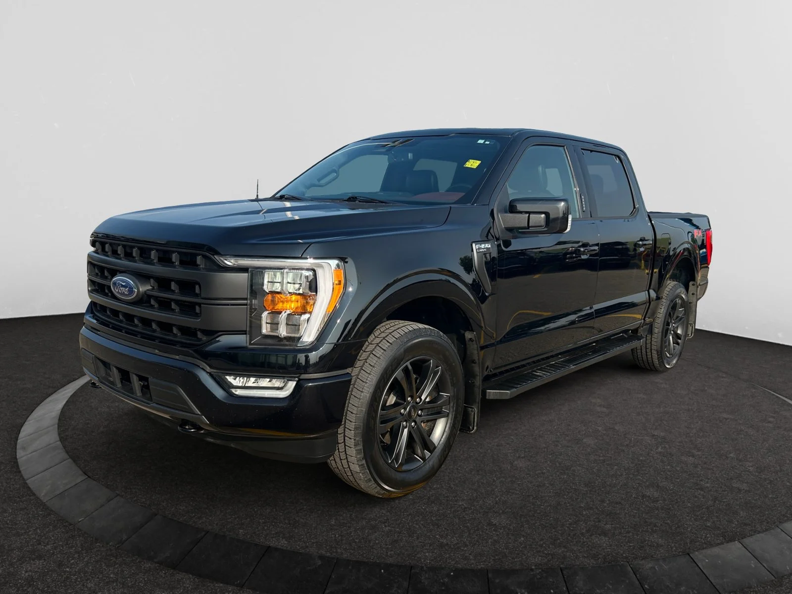 Used 2021 BLACK Ford LARIAT SuperCrew image 1