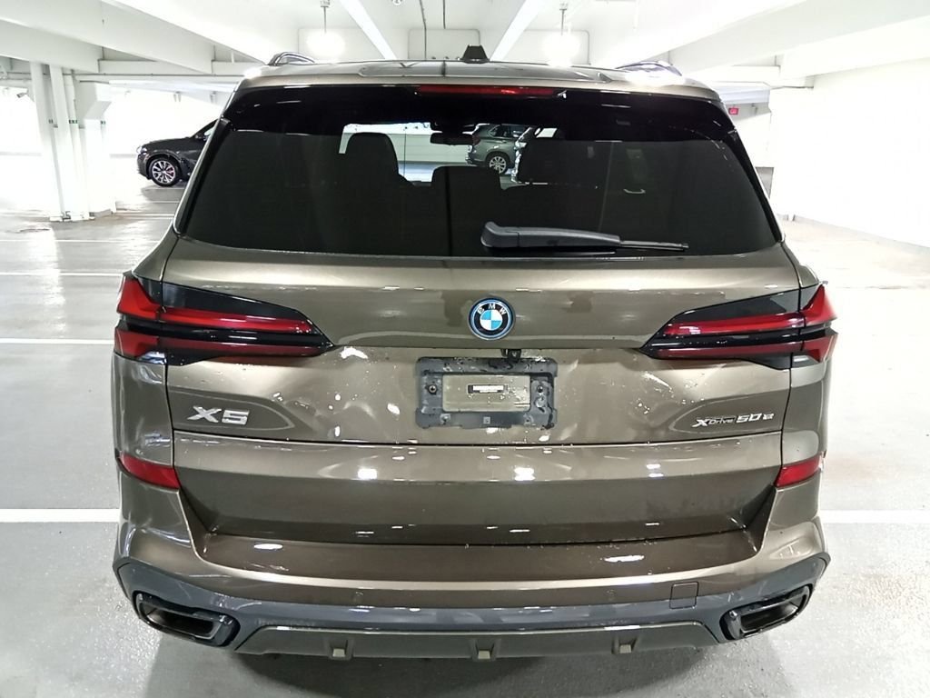 Used 2024 Manhattan Green Metallic BMW xDrive50e image 6