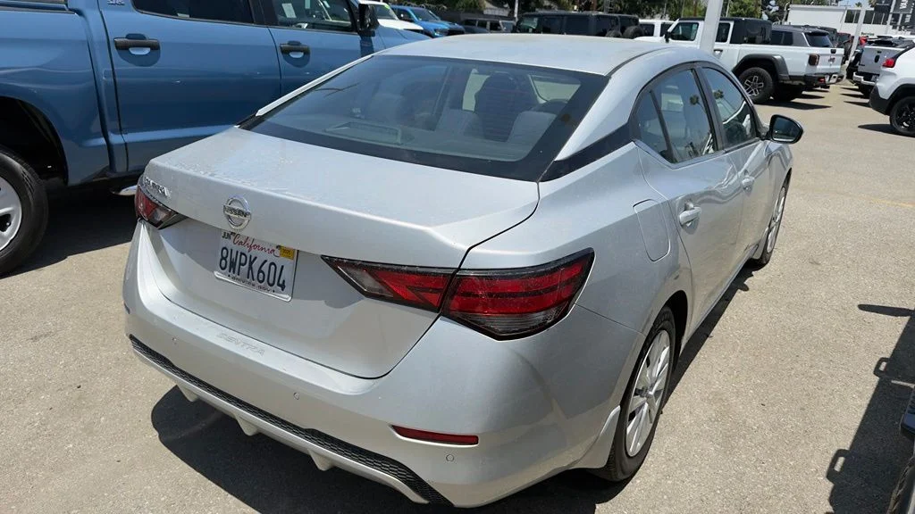 Used 2021 Brilliant Silver Metallic Nissan S image 3