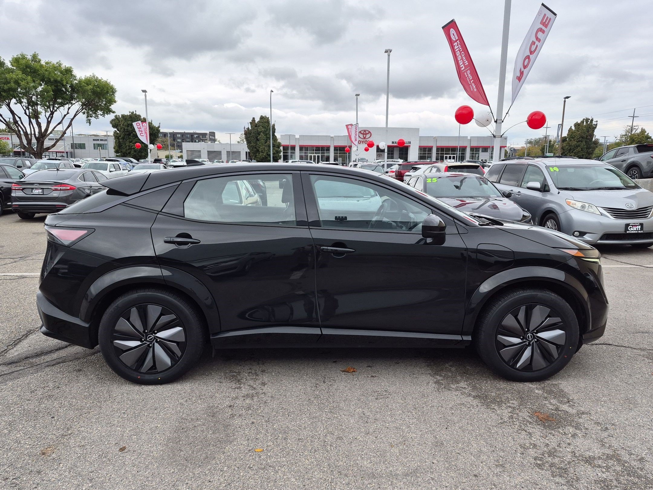 Certified Used 2024 Black Diamond Pearl Nissan EVOLVE+ image 2