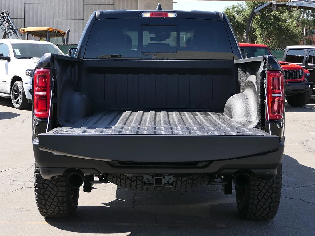 New 2026 Diamond Black Crystal Pearl Coat RAM RHO Crew Cab 4x4 5