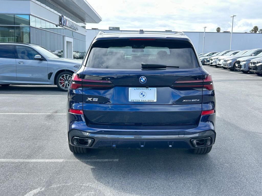 New 2026 Tanzanite Blue II Metallic BMW xDrive50e image 4