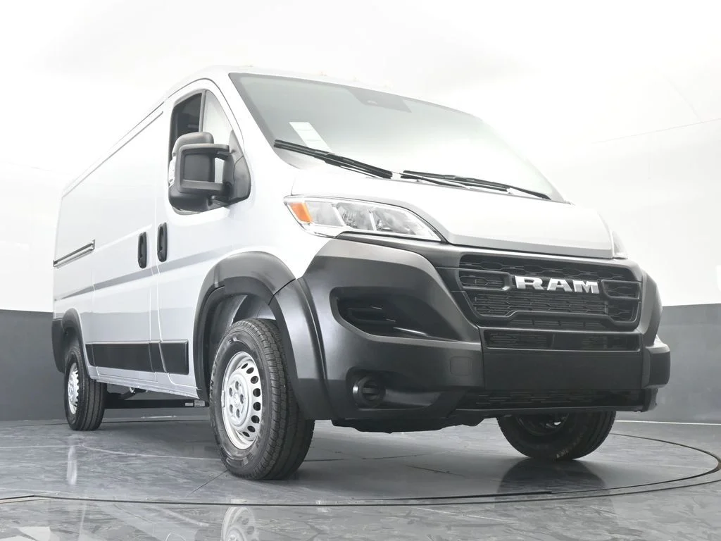 Used 2025 Bright Silver Clearcoat Metallic Ram Low Roof image 54