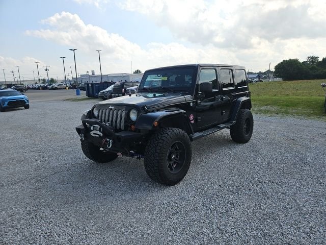 Used 2013 Black Jeep Unlimited Sahara image 2