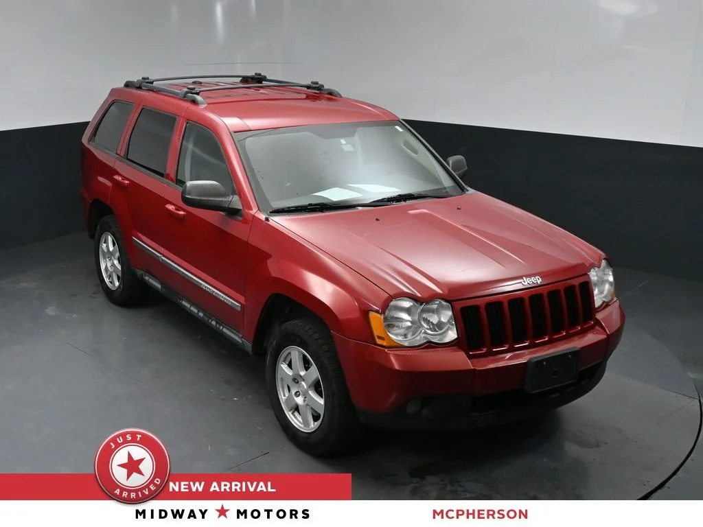 Used 2010 Red Jeep Laredo image 1