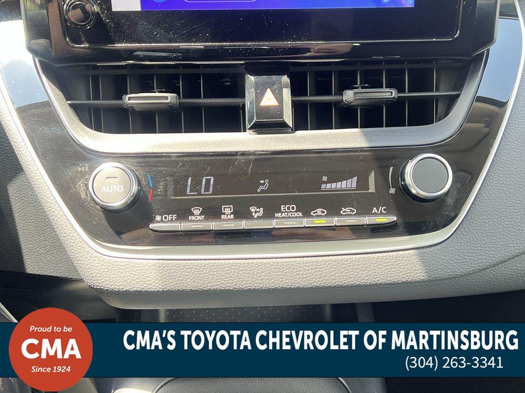 Used 2025 Midnight Black Metallic Toyota Hybrid LE image 19