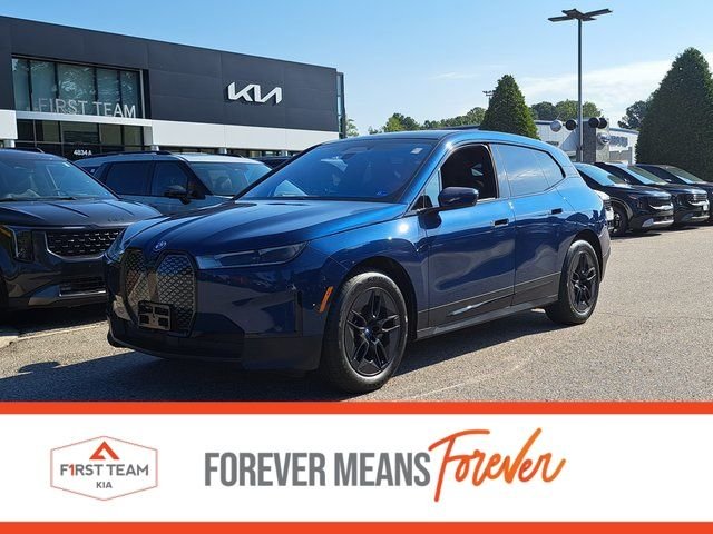 Used 2025 Blue BMW xDrive50 image 1