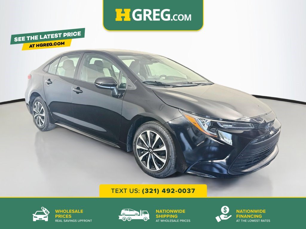 Used 2023 Midnight Black Metallic Toyota LE image 1