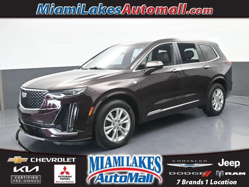 Used 2021 Garnet Metallic Cadillac Luxury image 1