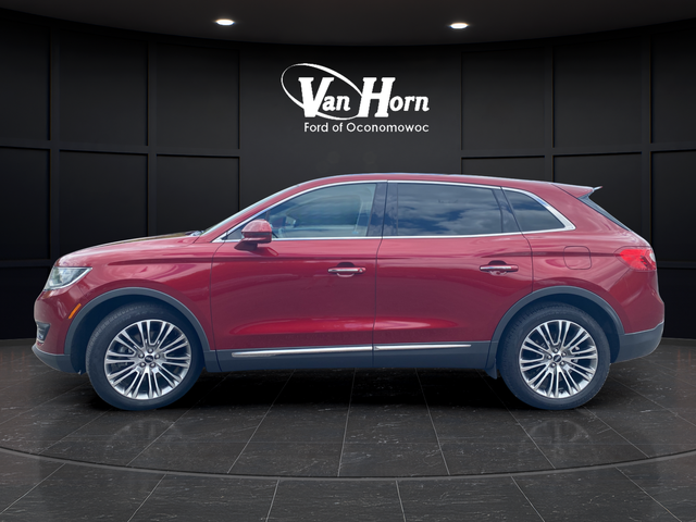 Used 2016 Ruby Red Metallic Lincoln Reserve image 4