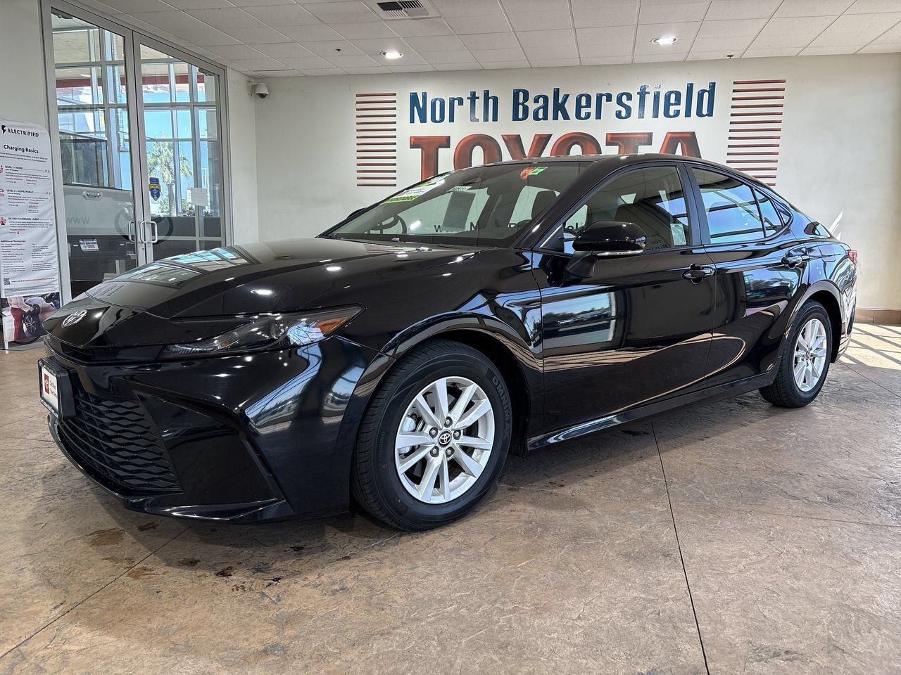 Certified Used 2025 Midnight Black Metallic Toyota LE image 1