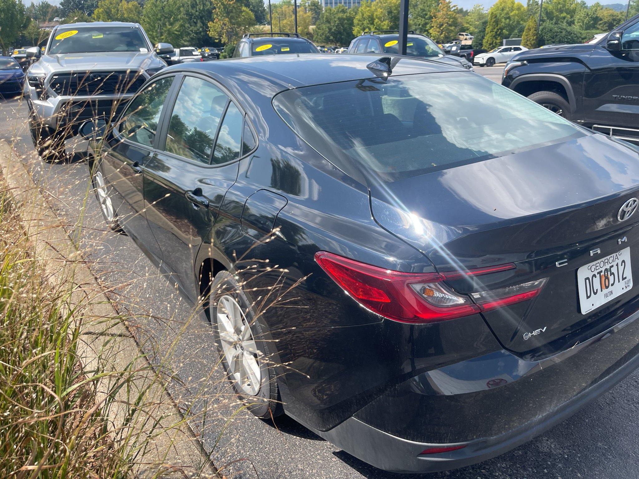 Used 2025 Midnight Black Metallic Toyota LE image 4