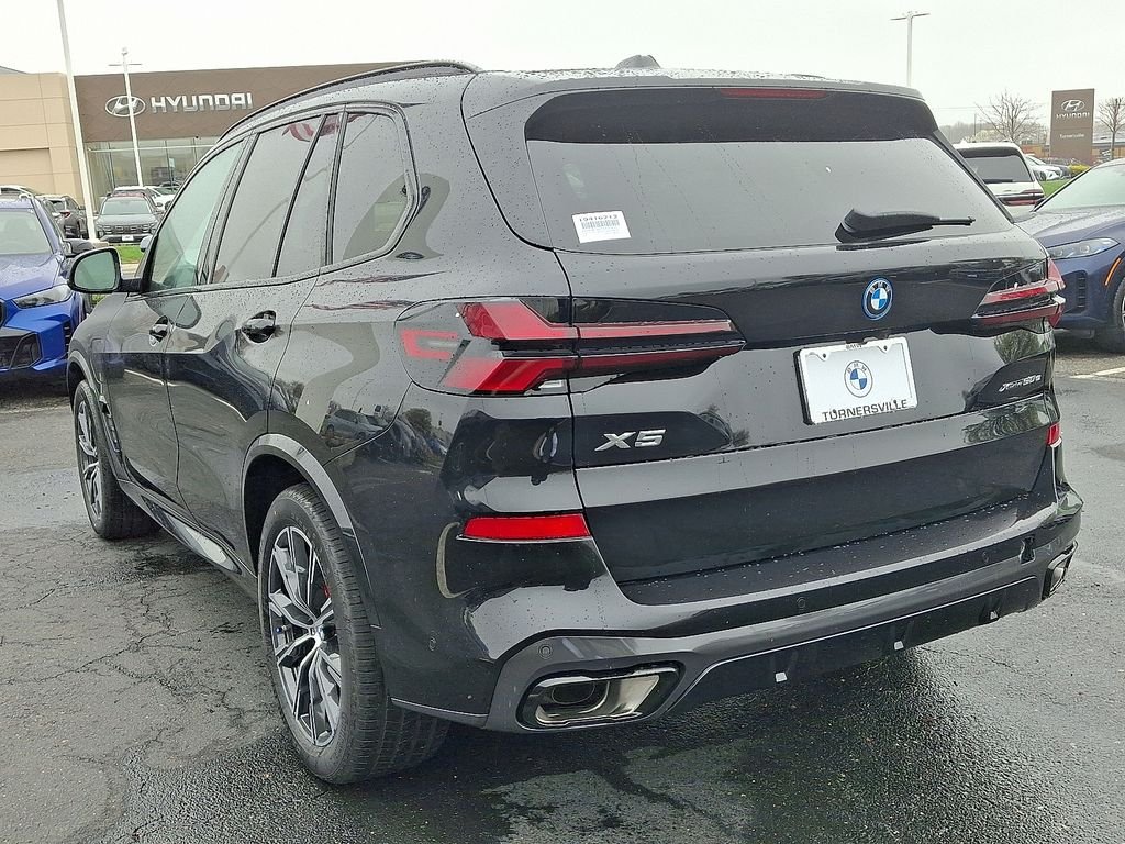 Used 2026 Black Sapphire Metallic BMW xDrive50e image 3