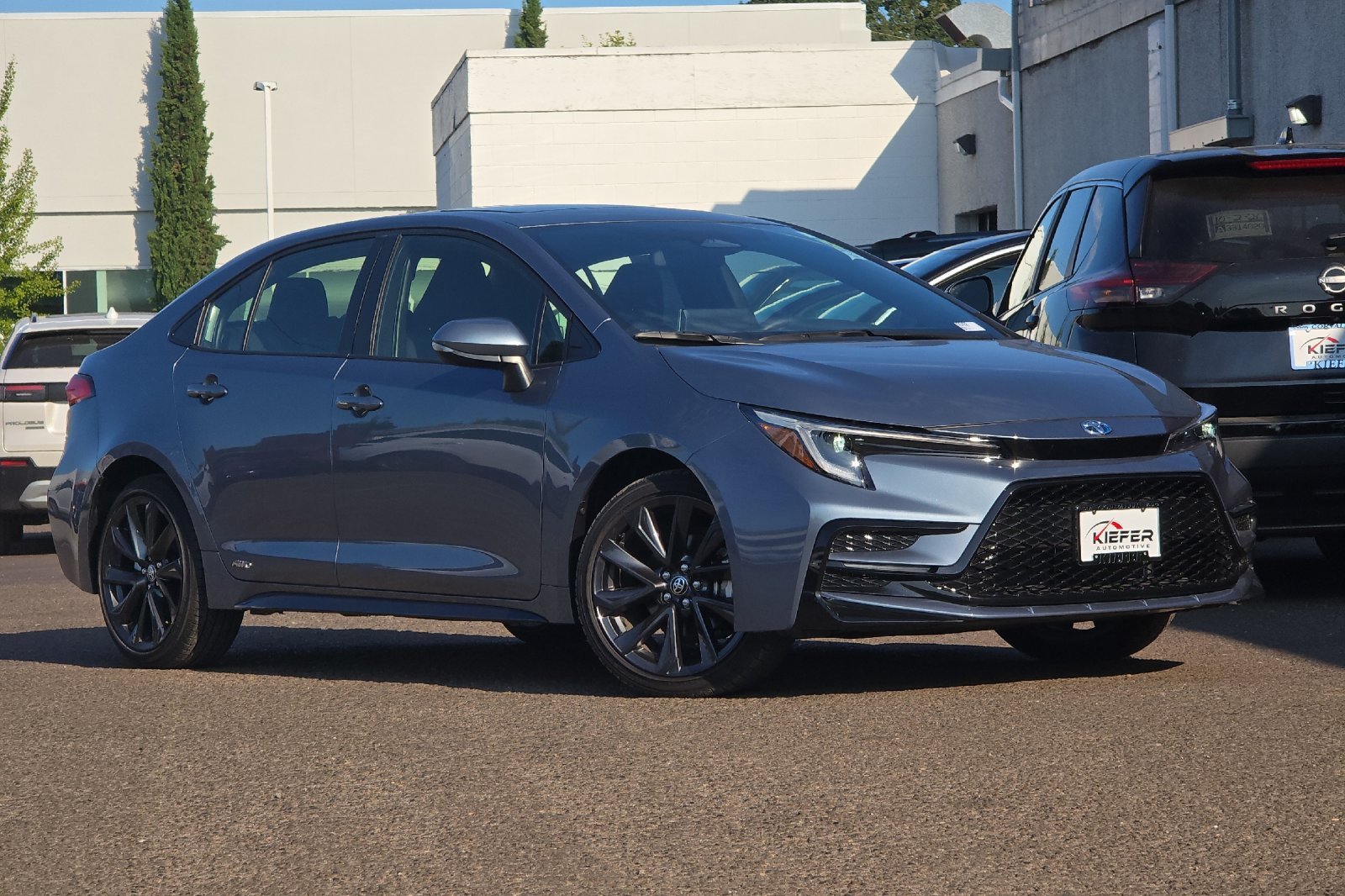 Used 2025 Blue Toyota Hybrid LE image 2