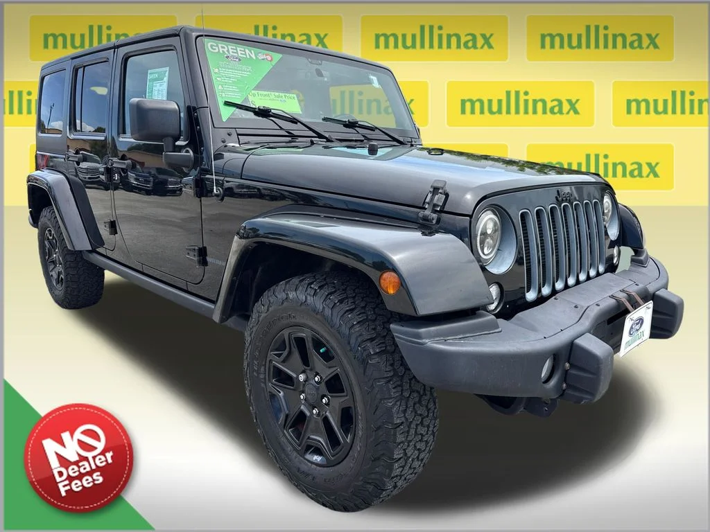 Used 2016 Black Jeep Unlimited Sahara image 1