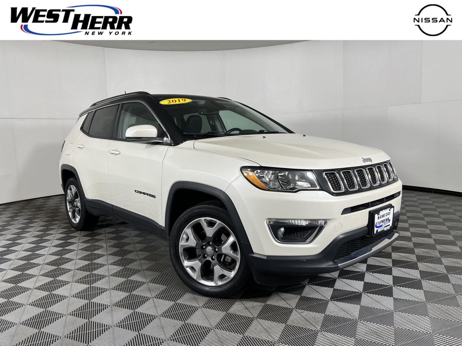 Used 2019 Pearl White Tri-Coat Jeep Limited image 1