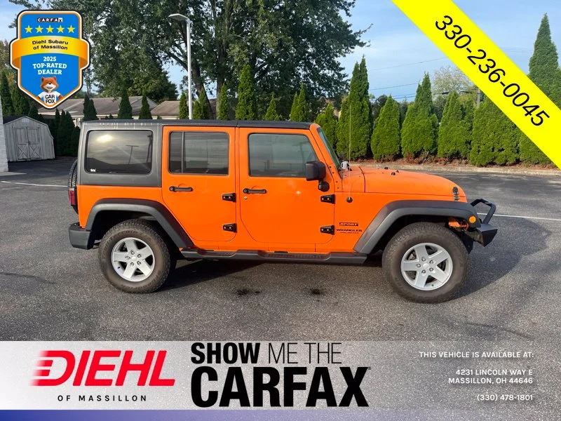 Used 2013 Orange Jeep Unlimited Sport image 2