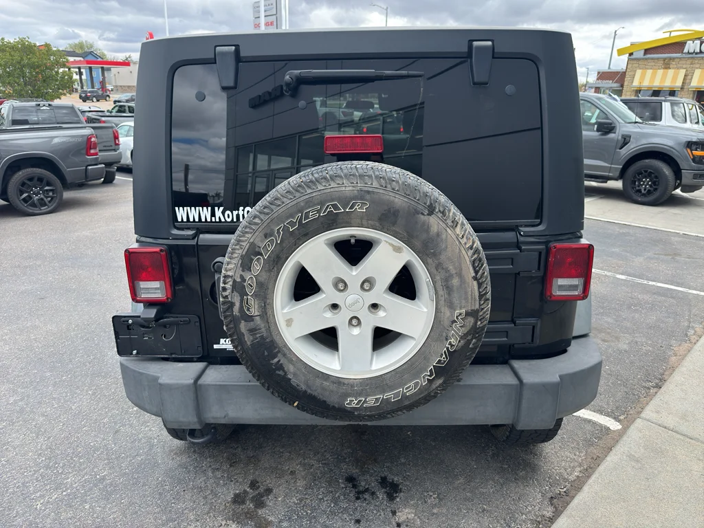 Used 2011 Black Clearcoat Jeep Sport image 4