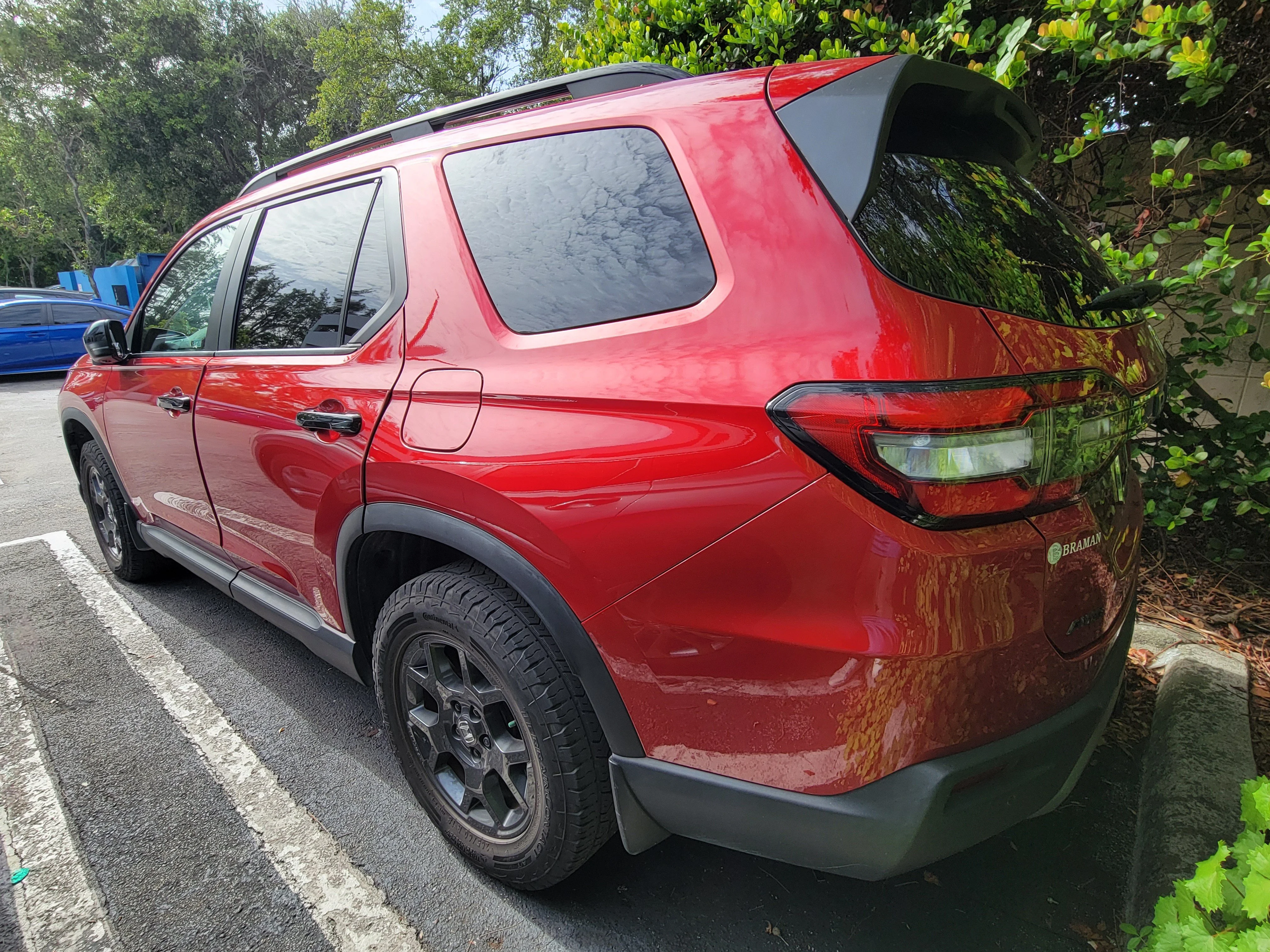 Certified Used 2024 Radiant Red Metallic II Honda AWD TRAILSPORT image 4
