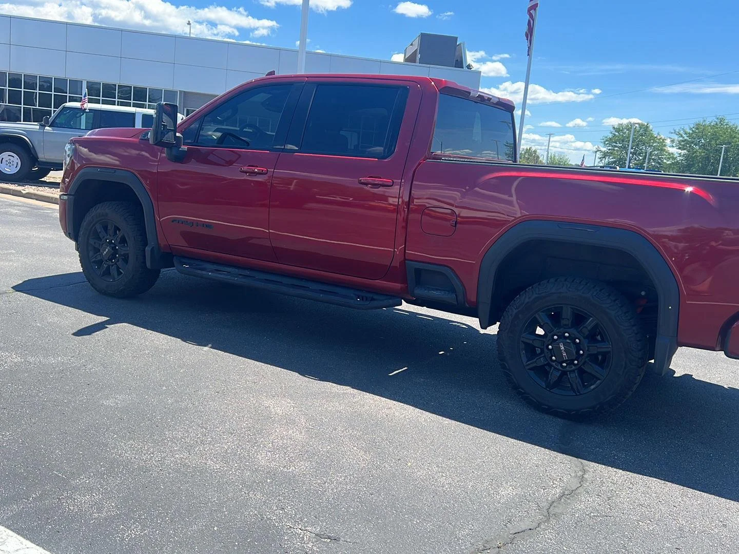Used 2024 Volcanic Red Tintcoat GMC AT4 image 13
