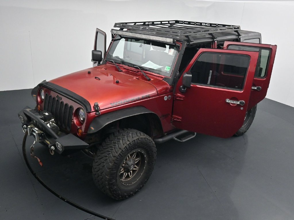 Used 2012 Red Jeep Unlimited Sport image 26