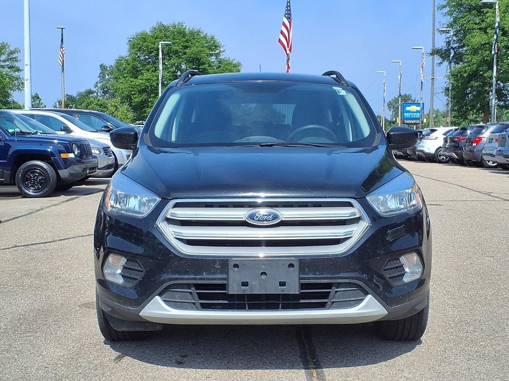 Used 2018 Ford Escape SE with VIN 1FMCU9GDXJUA69945 for sale in Howell, MI