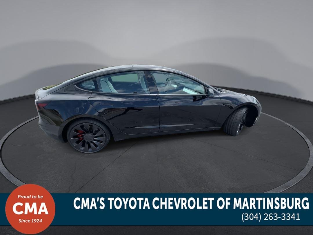 Used 2022 Solid Black Tesla Performance image 9