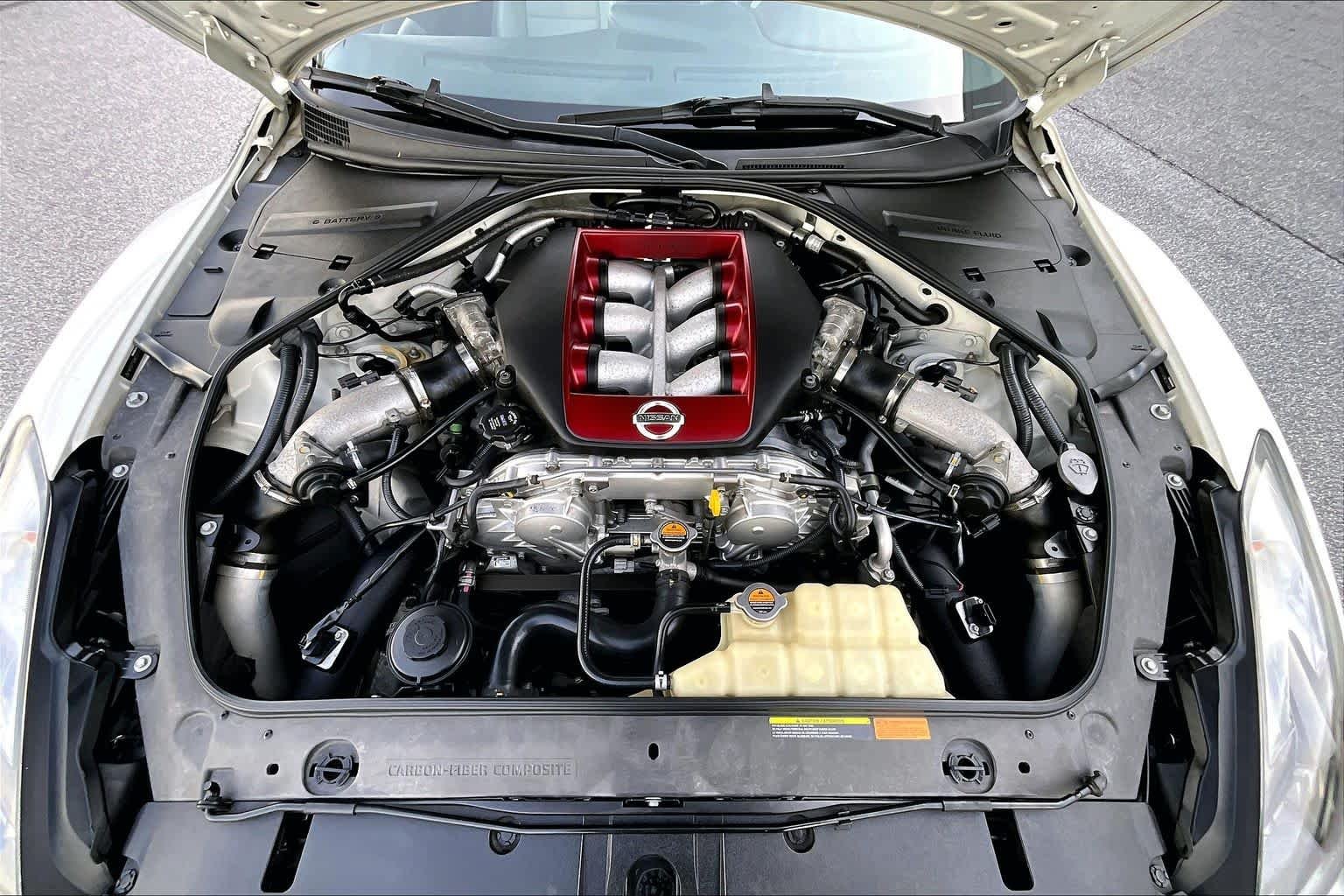 Used 2010 Pearl White Nissan Premium image 28