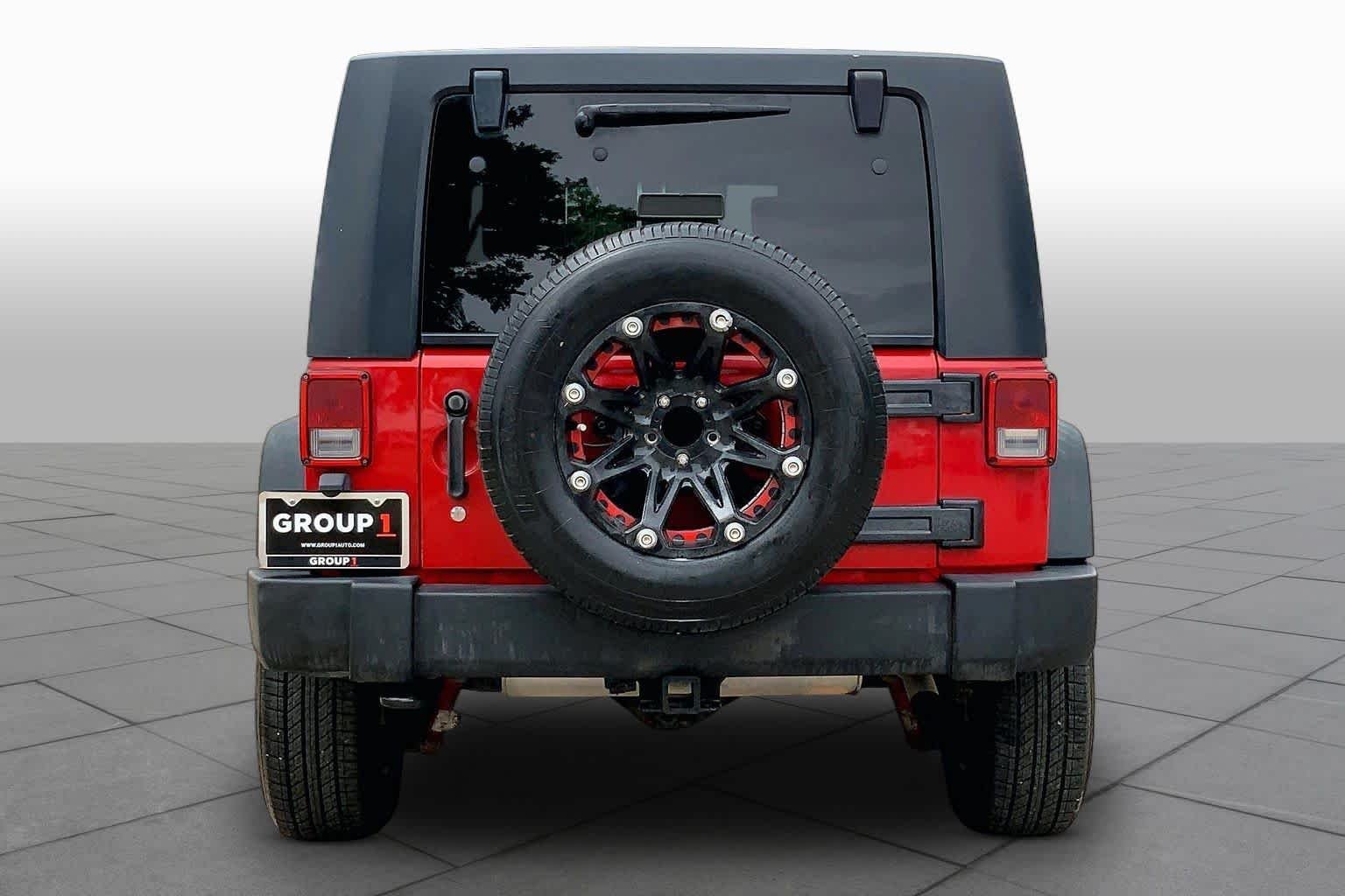 Used 2010 Flame Red Jeep Rubicon image 4