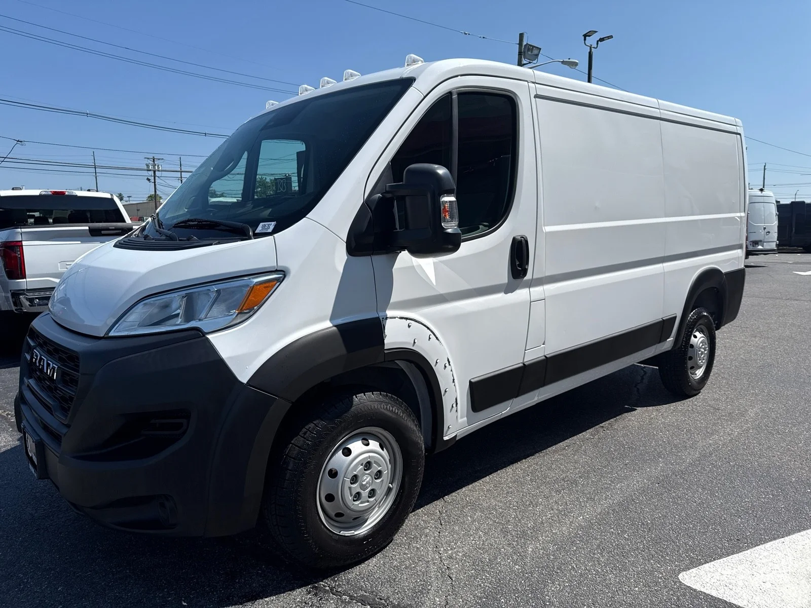 Used 2023 Bright White Clearcoat Ram Low Roof WB image 4