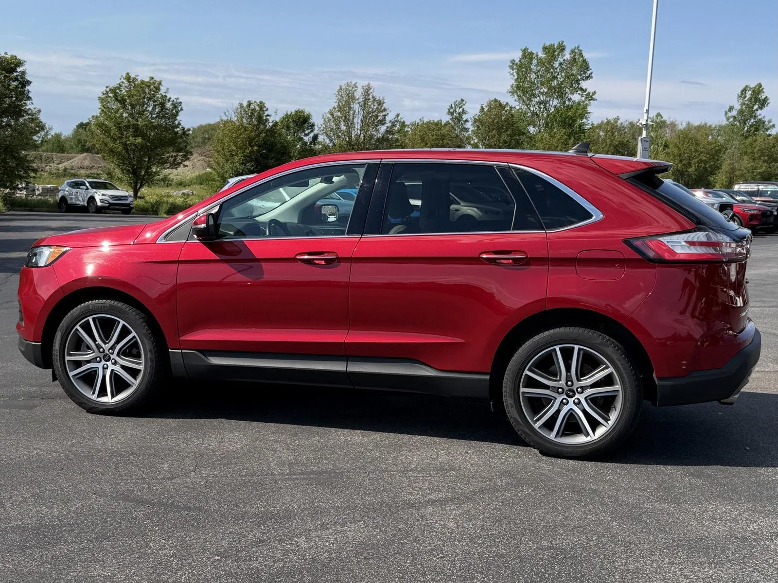 Used 2023 Rapid Red Metallic Tinted Clearcoat Ford Titanium image 5