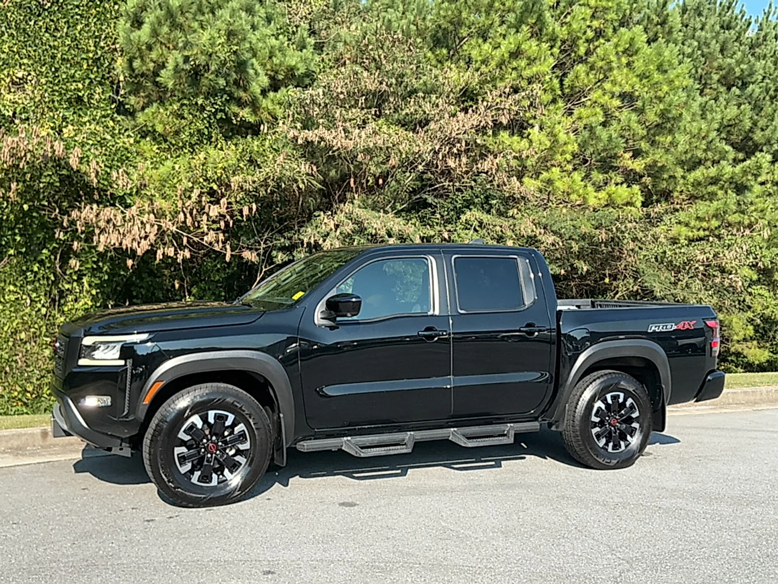 Used 2024 Super Black Nissan Crew Cab PRO-4X 4x4 image 4