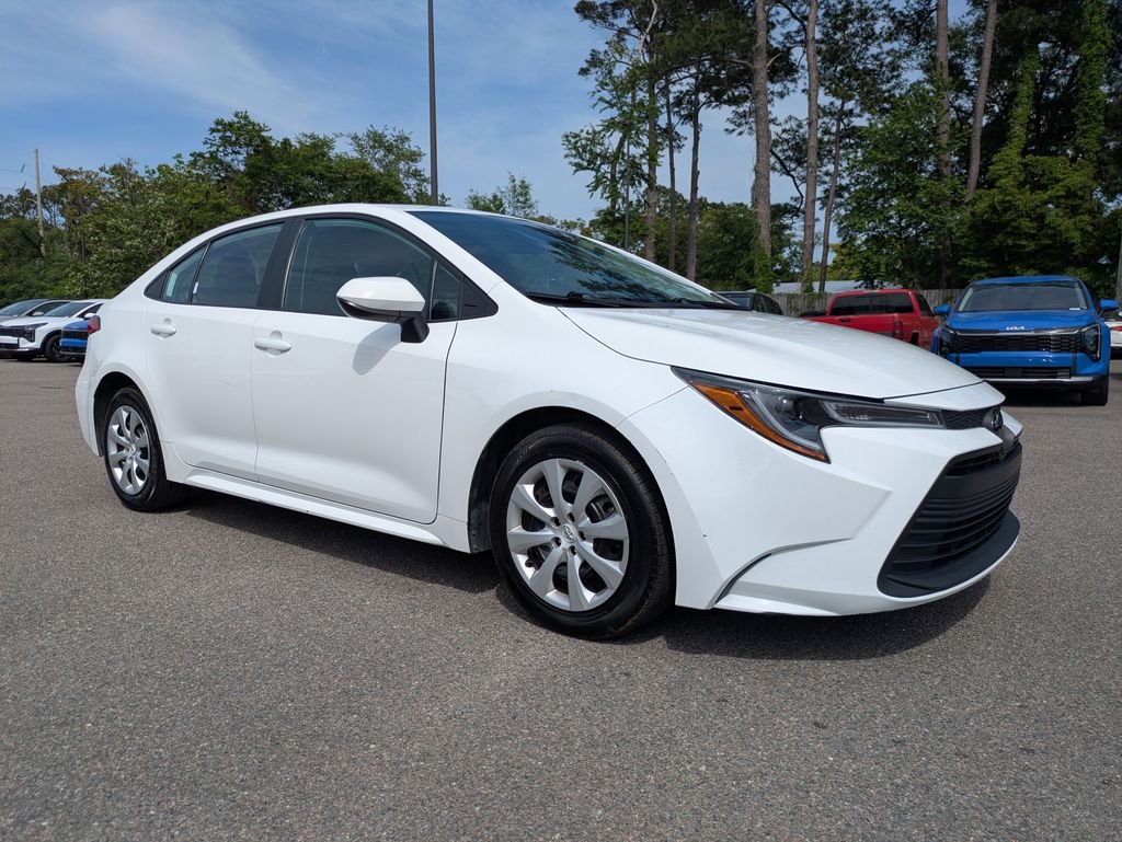 Used 2025 White Toyota LE image 1