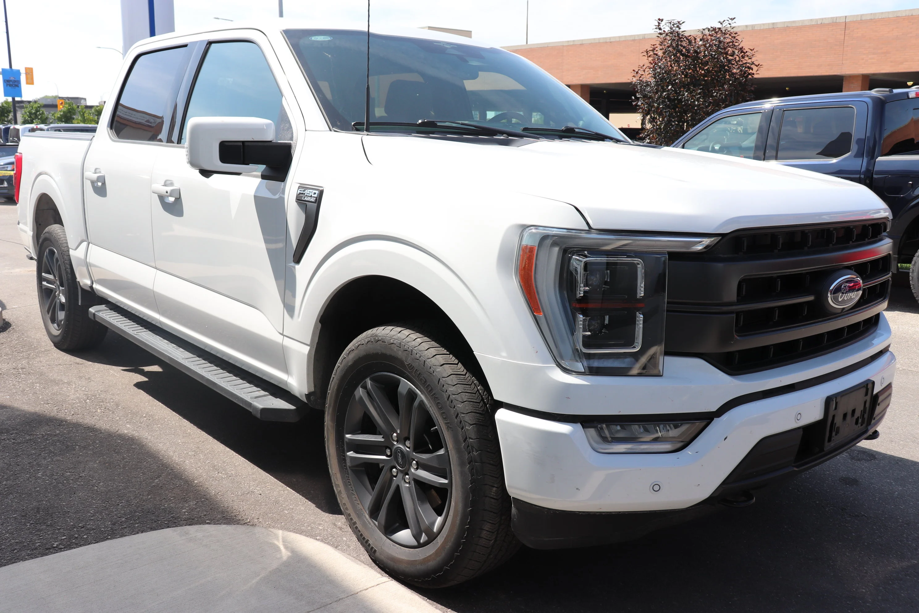 Certified Used 2023 Silver Ford Lariat 4WD SuperCrew 5.5